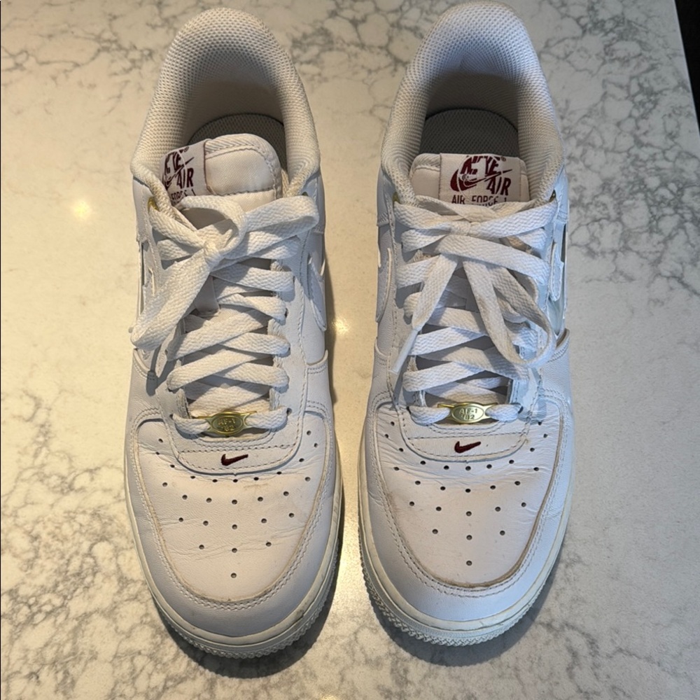 Commemorative Nike Air Force 1 White Sneakers with gold embellishments